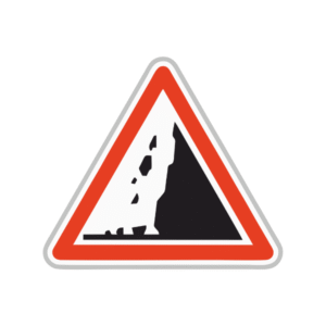Panneau de danger risque de chute de pierres sur la route.