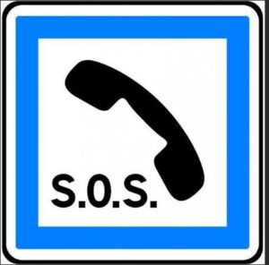 Panneau de signalisation indiquant un téléphone d’urgence.
